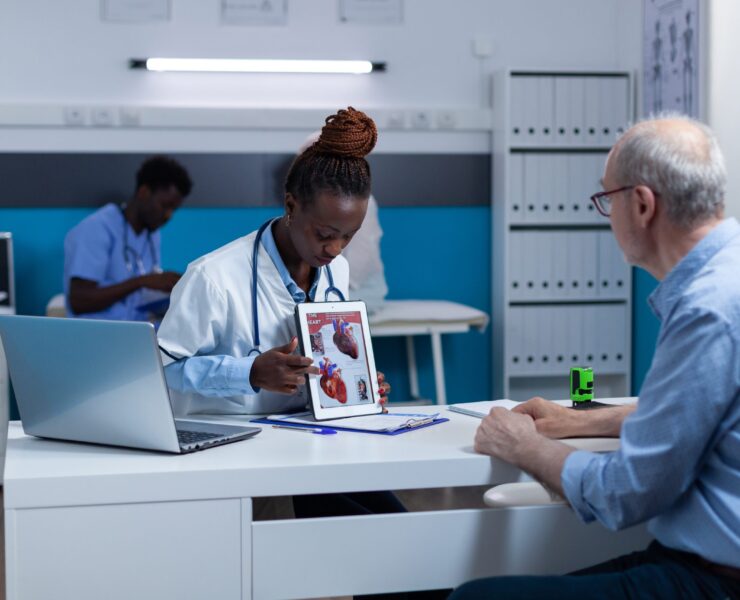 Clinician educating cardiac patient