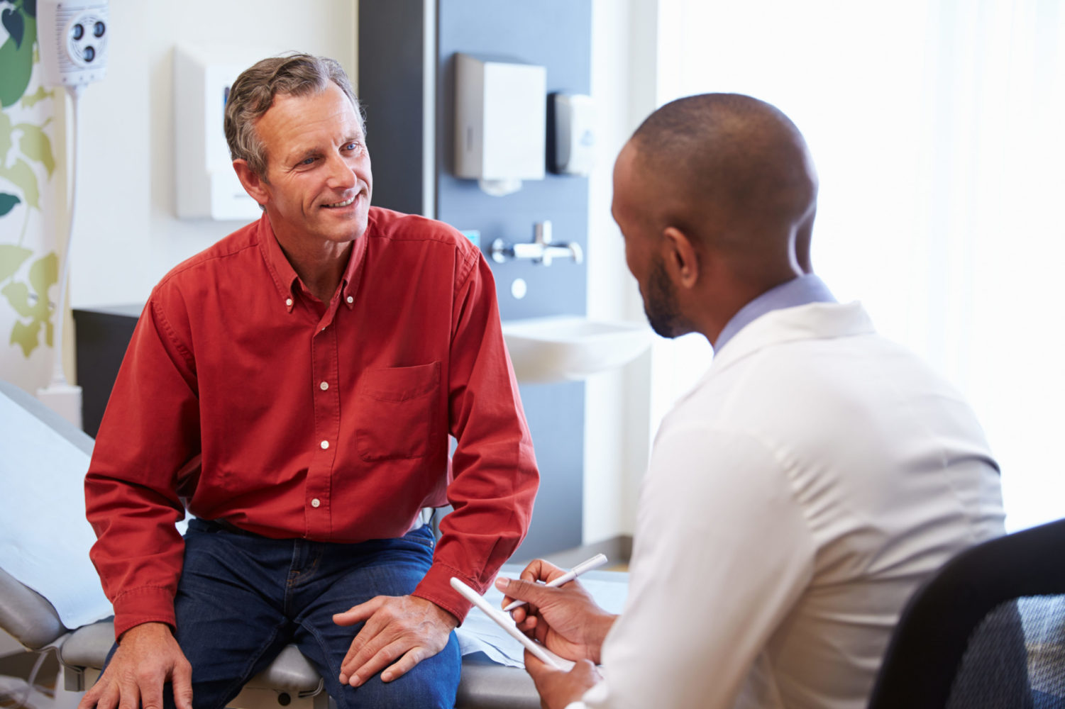 Male patient and doctor in clinic setting