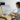 Woman in light blue scrubs working on remote monitoring billing codes